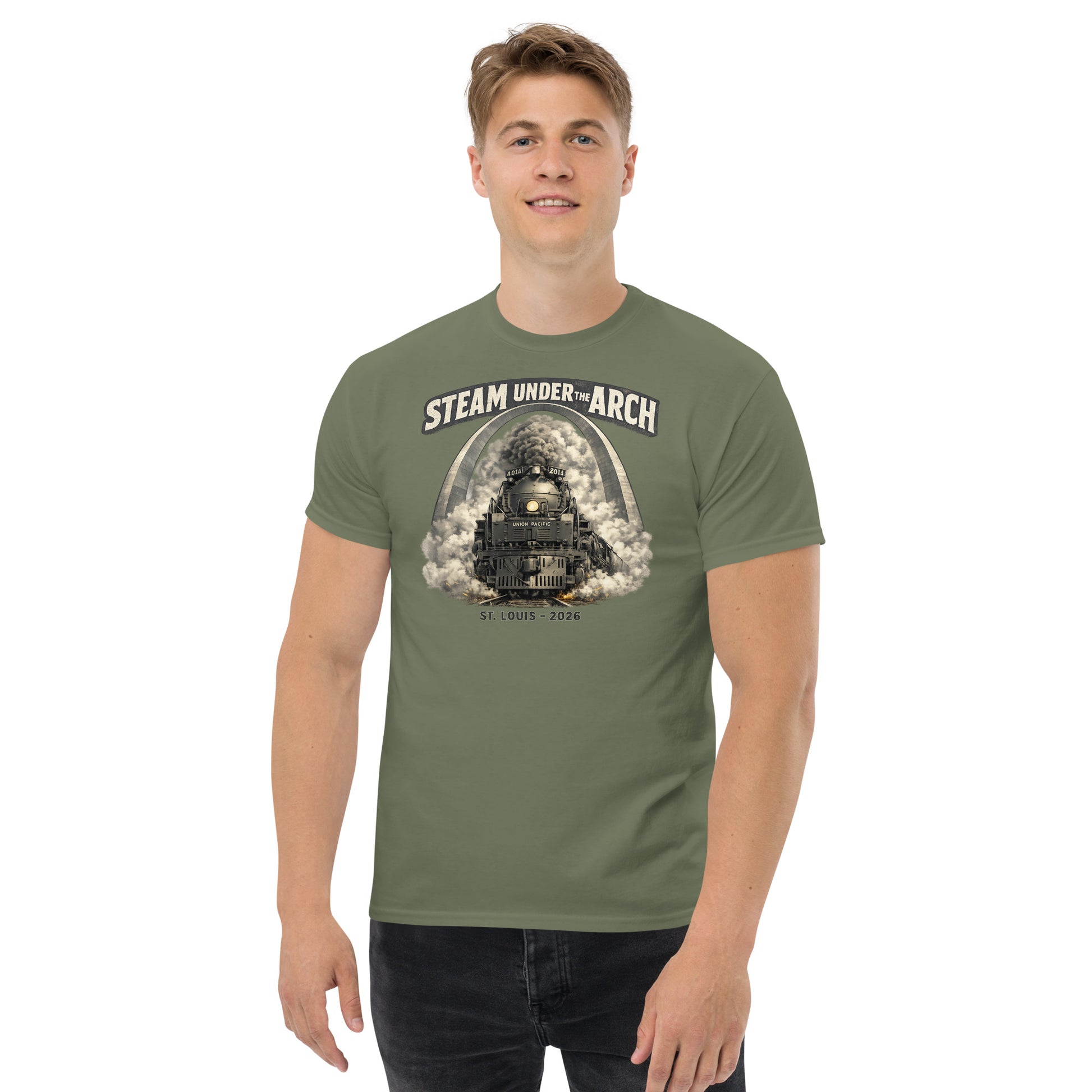 Military green t-shirt featuring the Big Boy 4014 steam locomotive under the St. Louis Gateway Arch, with text reading "Steam Under The Arch" and "St. Louis - 2026".