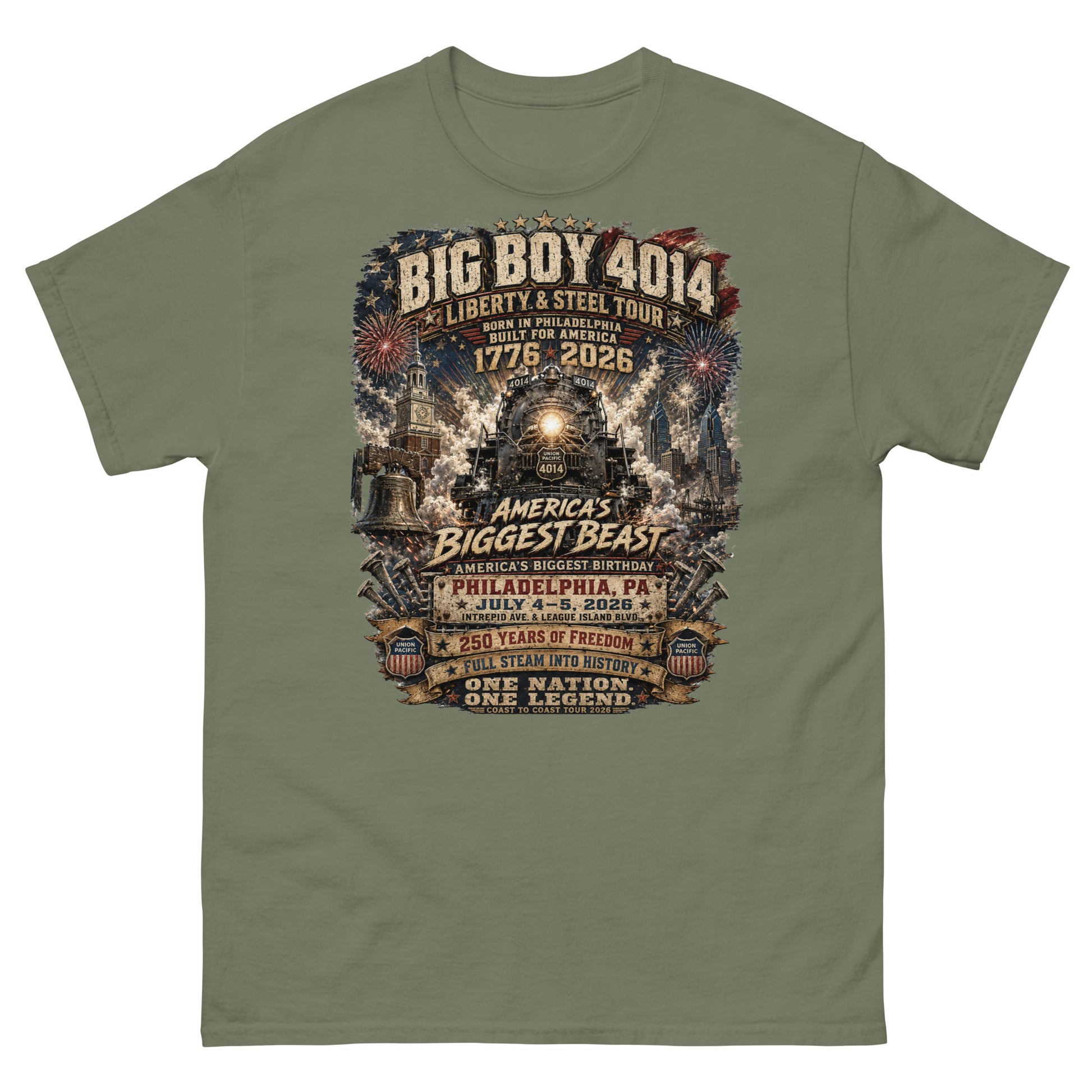 Army green t-shirt featuring a highly detailed graphic of the Big Boy 4014 steam locomotive, Liberty Bell, Independence Hall, and Philadelphia skyline with fireworks. Text reads "BIG BOY 4014", "LIBERTY & STEEL TOUR", "BORN IN PHILADELPHIA BUILT FOR AMERICA", "1776 - 2026", "AMERICA'S BIGGEST BEAST", "AMERICA'S BIGGEST BIRTHDAY", "PHILADELPHIA, PA JULY 4-5, 2026", "250 YEARS OF FREEDOM", "FULL STEAM INTO HISTORY", and "ONE NATION. ONE LEGEND."