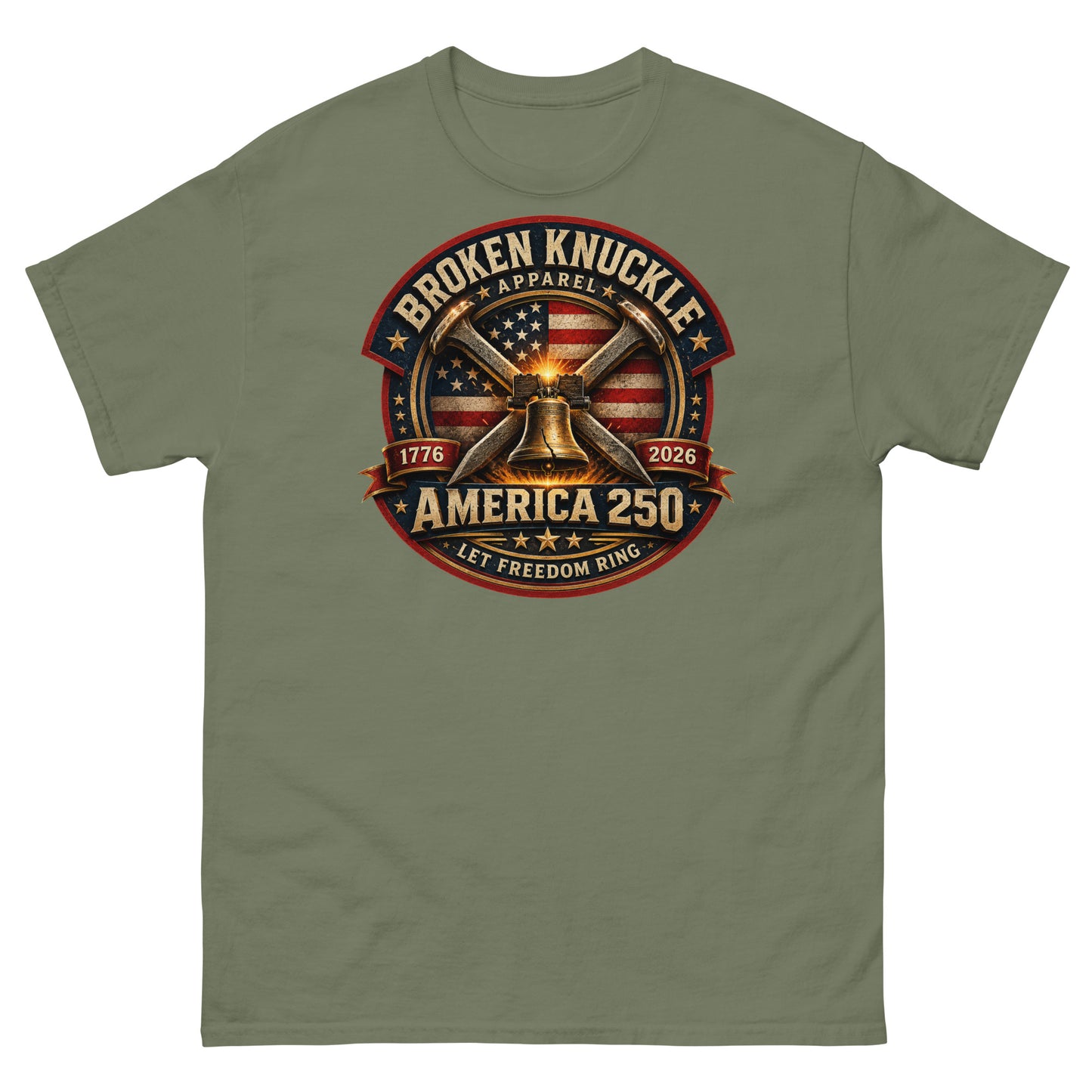 Army green t-shirt featuring a circular patriotic graphic. The design includes an American flag background, two crossed railroad spikes, and a glowing Liberty Bell in the center. Text around the badge reads "BROKEN KNUCKLE APPAREL", "1776", "2026", "AMERICA 250", and "LET FREEDOM RING".