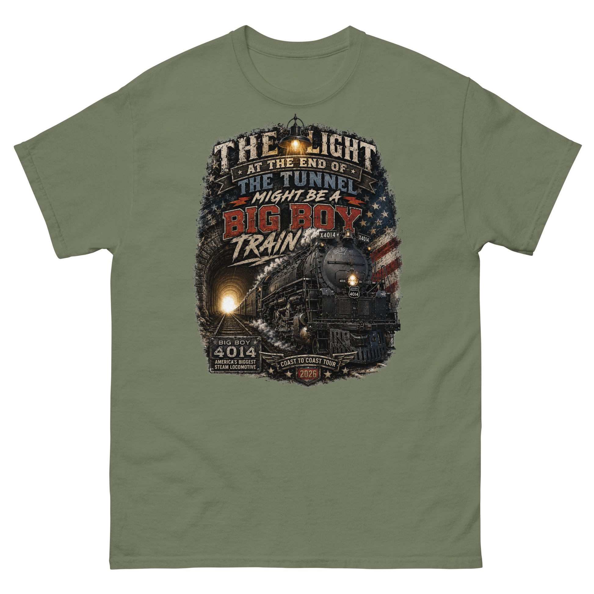 Army green t-shirt featuring a highly detailed vintage graphic. The design shows the Big Boy 4014 steam locomotive emerging from a dark tunnel with a glowing light behind it. A vintage lantern hangs at the top, and a distressed American flag is on the right. Bold text reads "THE LIGHT AT THE END OF THE TUNNEL MIGHT BE A BIG BOY TRAIN". Bottom badges read "BIG BOY 4014 AMERICA'S BIGGEST STEAM LOCOMOTIVE" and "COAST TO COAST TOUR 2026".