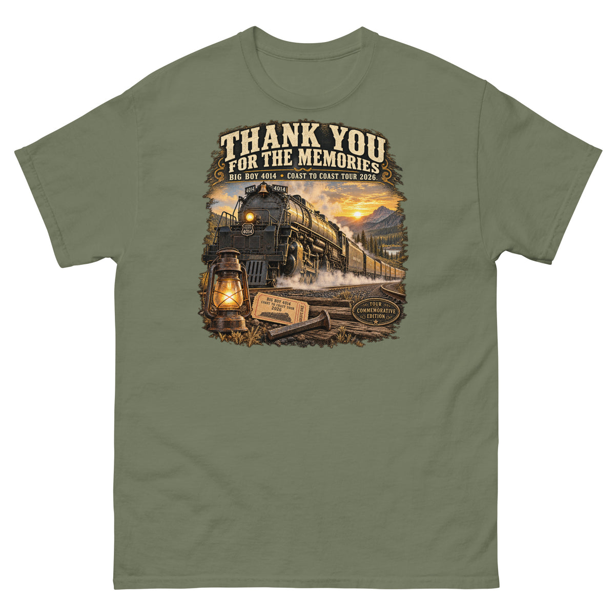 Army green classic t-shirt featuring a detailed vintage graphic of the Big Boy 4014 steam locomotive traveling through a mountain landscape at sunset. Bold, vintage-style text reads "THANK YOU FOR THE MEMORIES" and "BIG BOY 4014 - COAST TO COAST TOUR 2026". The bottom of the design features a glowing lantern, a commemorative ticket, a railroad spike, and a "TOUR COMMEMORATIVE EDITION" badge.