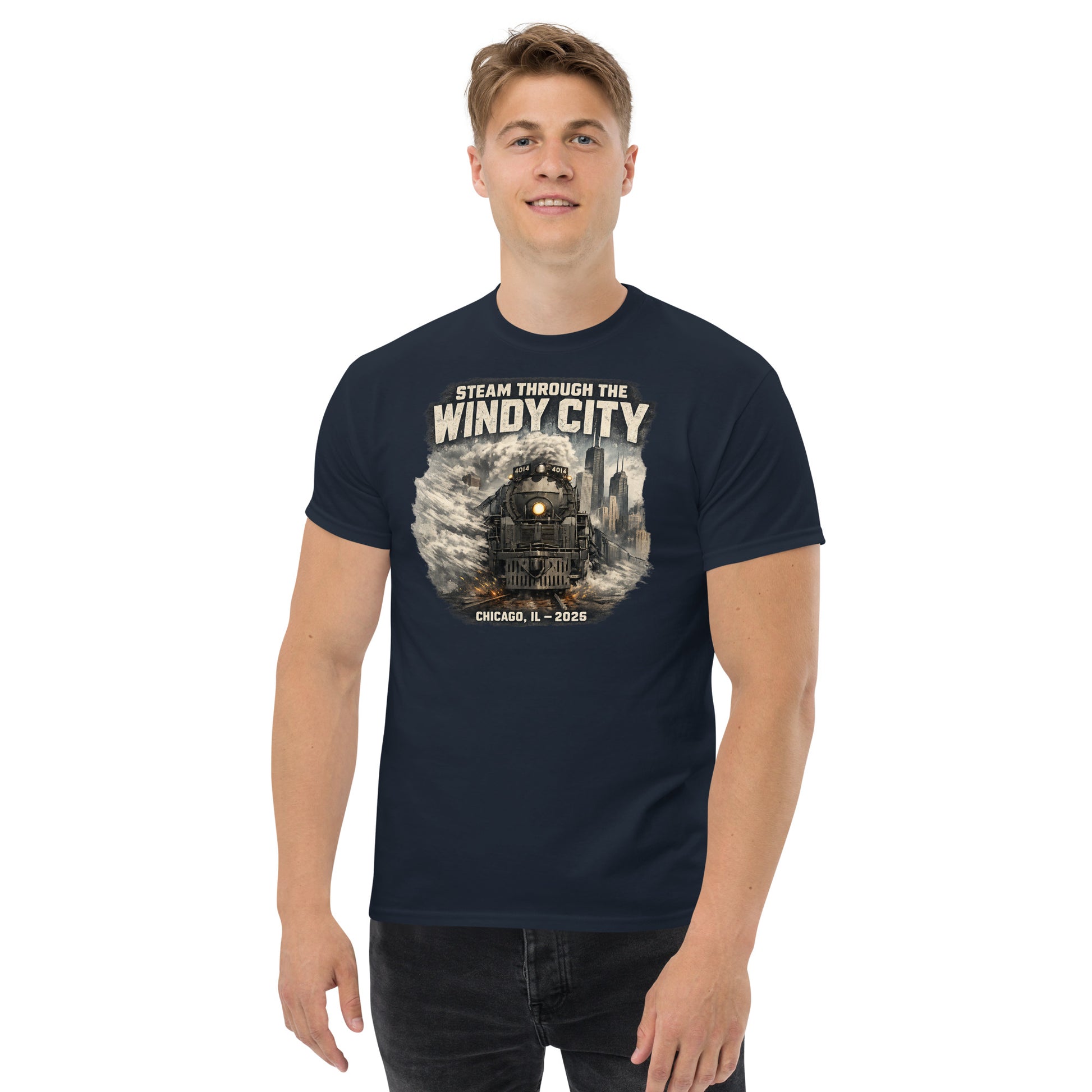 Navy t-shirt featuring a graphic of a steam locomotive emerging from smoke in front of a city skyline, with text reading "STEAM THROUGH THE WINDY CITY" at the top and "CHICAGO, IL - 2026" at the bottom.