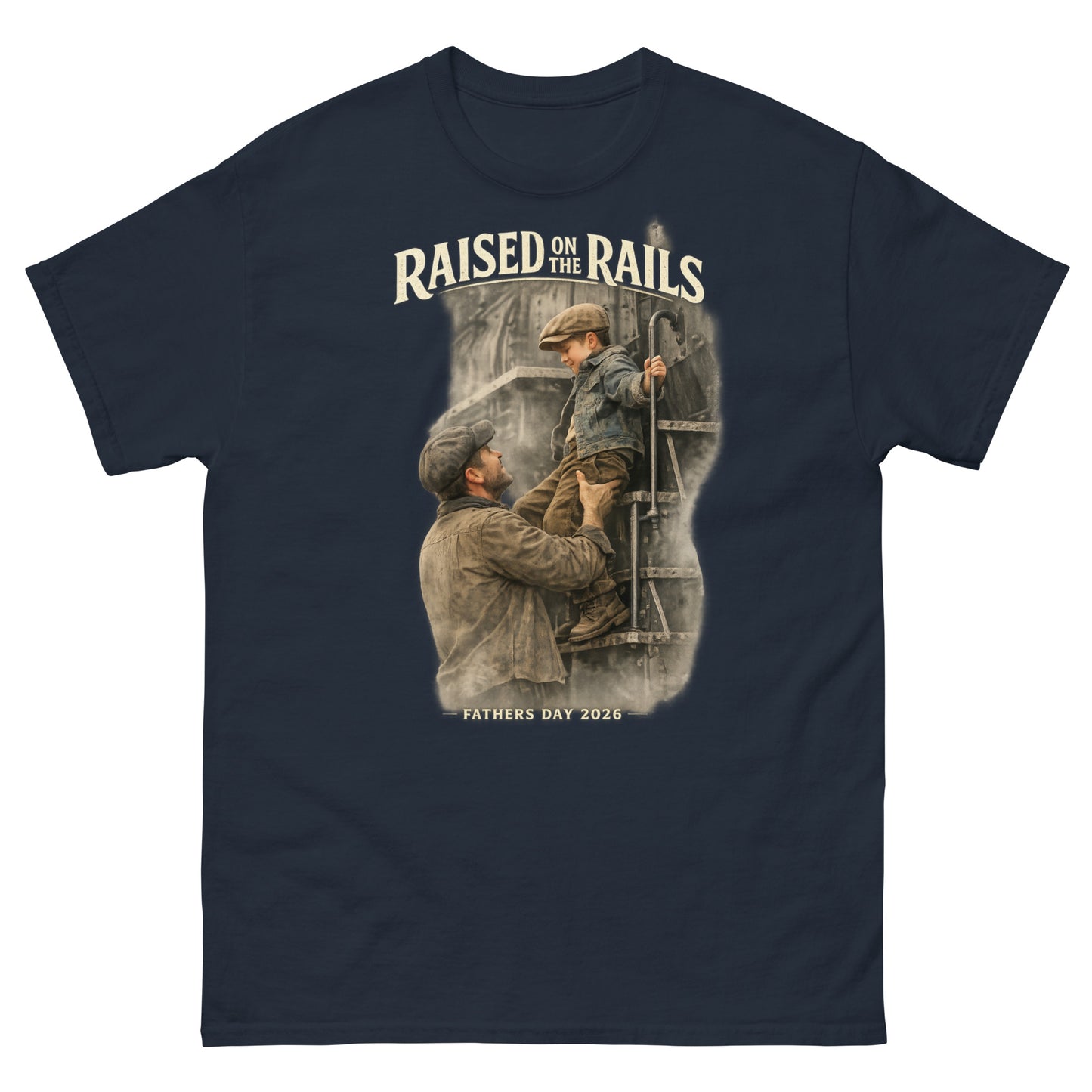 Navy t-shirt featuring a vintage-style graphic of a father lifting his young son onto a steam locomotive ladder, with text reading "Raised On The Rails" and "Fathers Day 2026".