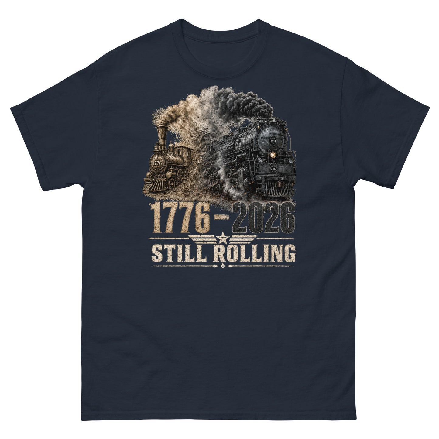 Navy t-shirt featuring a detailed graphic of two steam locomotives from different eras emerging from heavy smoke side-by-side, with bold distressed text reading "1776-2026" and "STILL ROLLING" flanked by a vintage star and wings emblem.