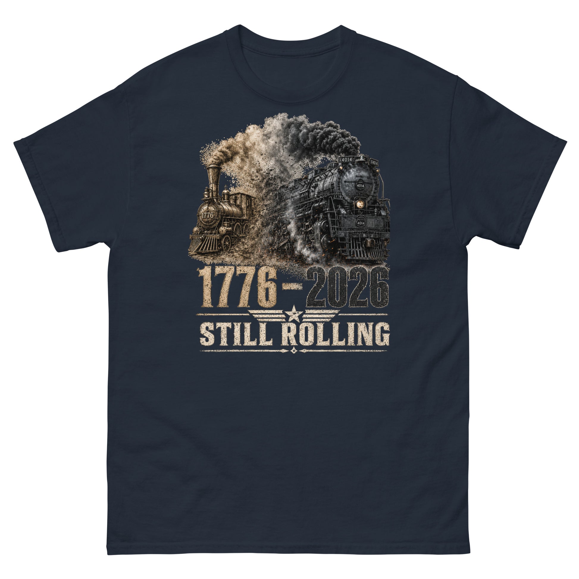 Navy t-shirt featuring a detailed graphic of two steam locomotives from different eras emerging from heavy smoke side-by-side, with bold distressed text reading "1776-2026" and "STILL ROLLING" flanked by a vintage star and wings emblem.