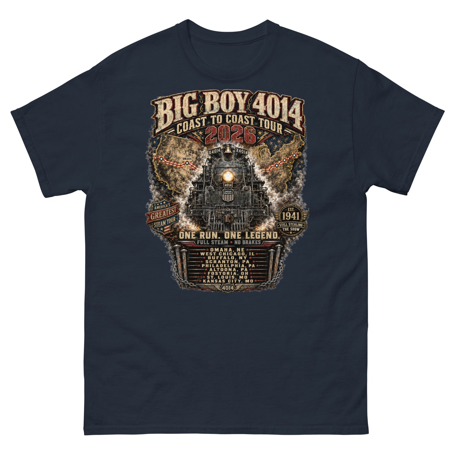 Navy t-shirt featuring a highly detailed, industrial graphic of the Big Boy 4014 steam locomotive backed by a US map, with text reading "BIG BOY 4014 COAST TO COAST TOUR 2026", "ONE RUN. ONE LEGEND.", and a roster of tour stops from Omaha to Kansas City surrounded by metal spikes and chains.