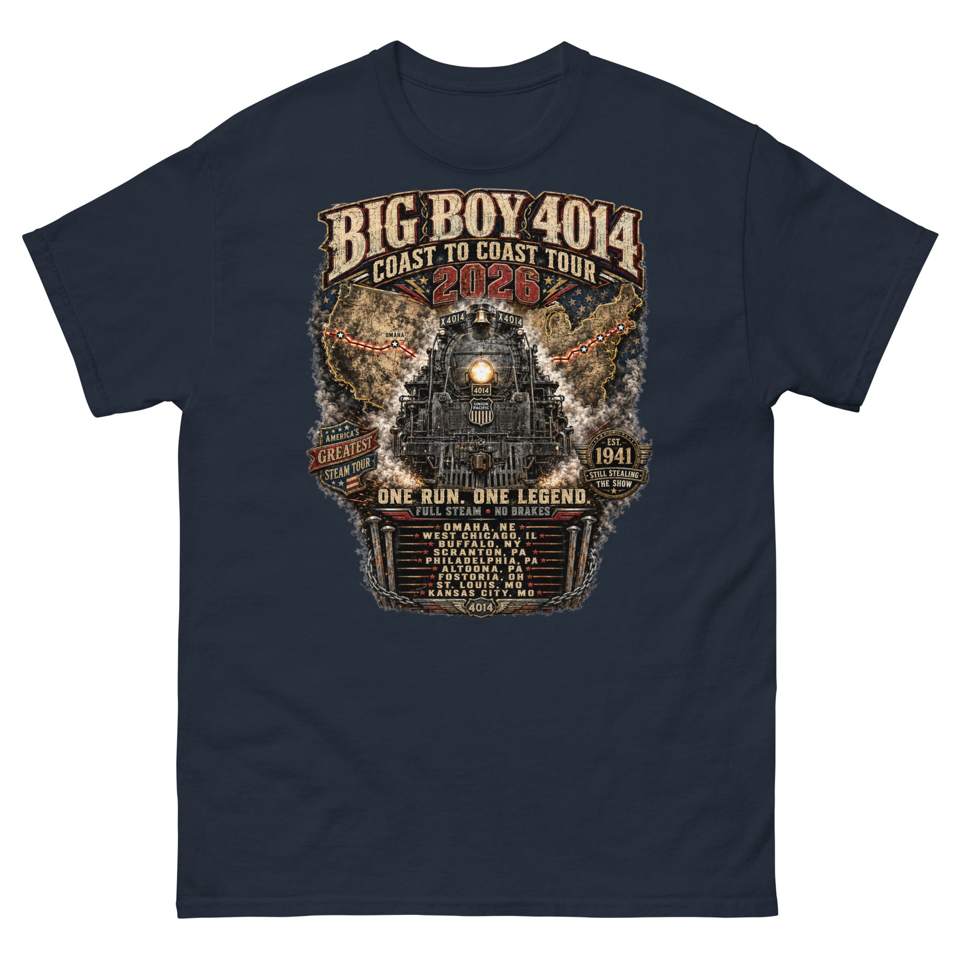 Navy t-shirt featuring a highly detailed, industrial graphic of the Big Boy 4014 steam locomotive backed by a US map, with text reading "BIG BOY 4014 COAST TO COAST TOUR 2026", "ONE RUN. ONE LEGEND.", and a roster of tour stops from Omaha to Kansas City surrounded by metal spikes and chains.