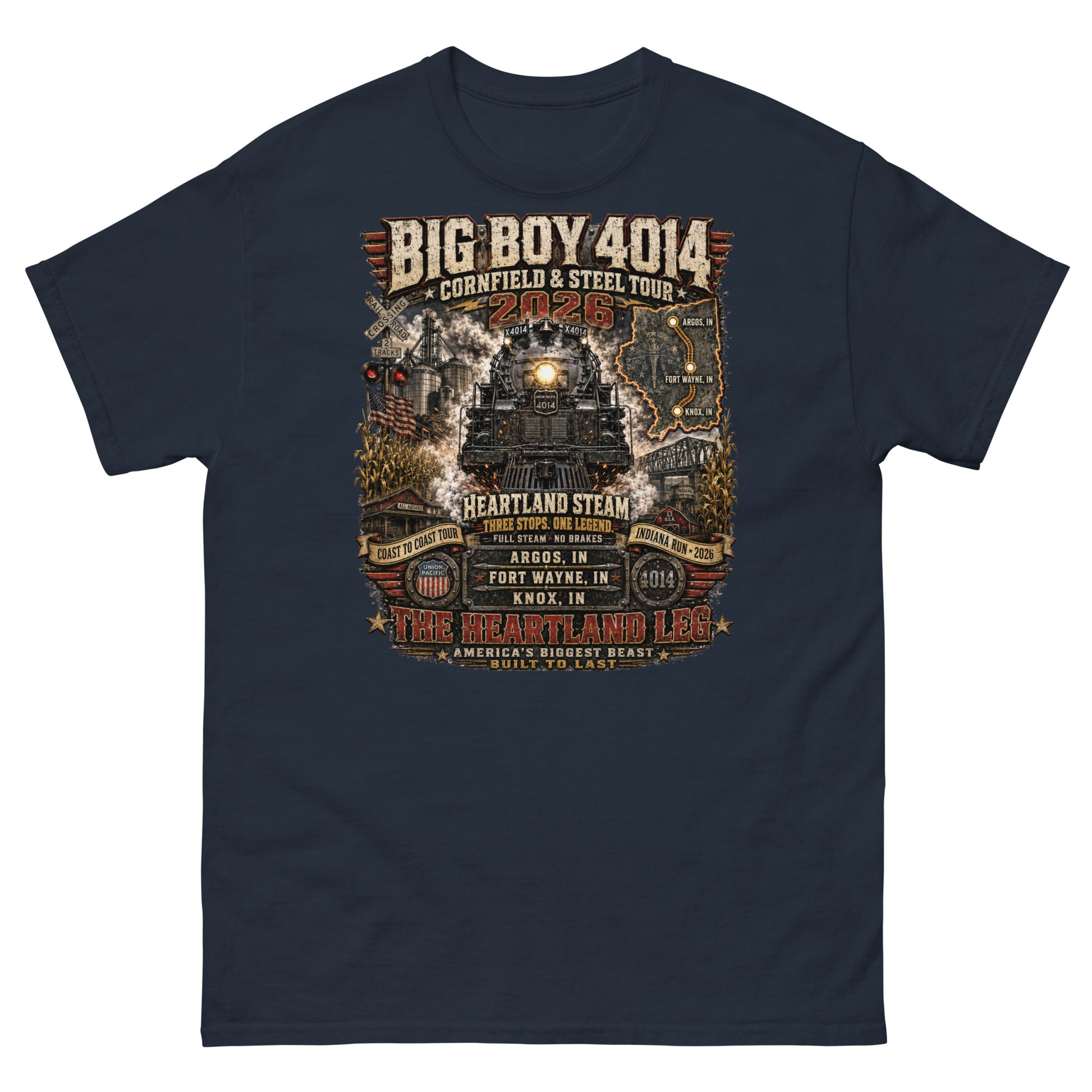 Black t-shirt featuring a highly detailed graphic of the Big Boy 4014 steam locomotive surrounded by cornfields, grain silos, and a steel bridge. Text reads "BIG BOY 4014", "CORNFIELD & STEEL TOUR 2026", "HEARTLAND STEAM", alongside banners for "COAST TO COAST TOUR" and "INDIANA RUN - 2026", plus a map and detailed roster of three Indiana tour stops: Argos, IN; Fort Wayne, IN; and Knox, IN above the text "THE HEARTLAND LEG".