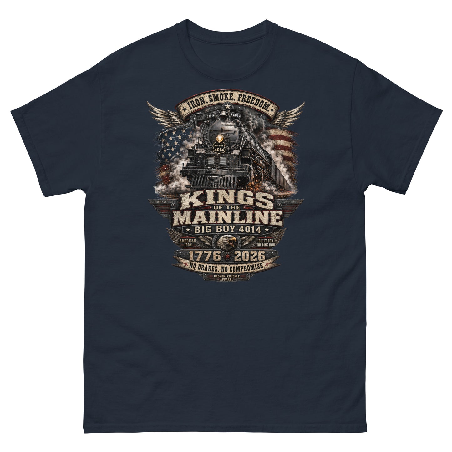 Navy t-shirt featuring a highly detailed patriotic graphic. The Big Boy 4014 steam locomotive is centered against a distressed American flag and wings. A banner at the top reads "IRON. SMOKE. FREEDOM." Large text reads "KINGS OF THE MAINLINE" and "BIG BOY 4014". Below is a bald eagle head between badges reading "AMERICAN IRON" and "BUILT FOR THE LONG HAUL". The bottom features "1776 - 2026", "NO BRAKES. NO COMPROMISE.", and "BROKEN KNUCKLE APPAREL".