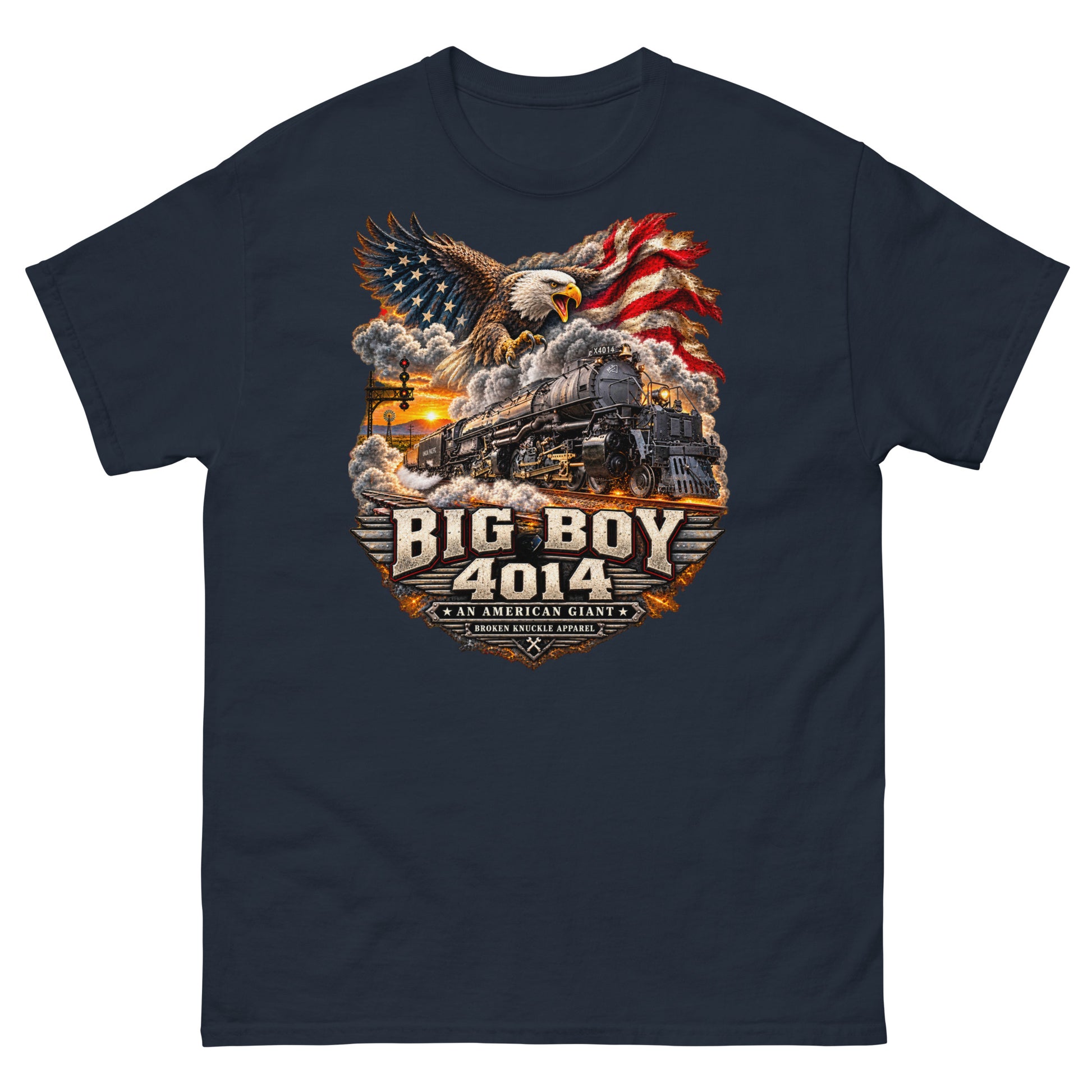 Navy classic t-shirt featuring a highly detailed patriotic graphic. A bald eagle and American flag soar above the Big Boy 4014 steam locomotive charging down the tracks at sunset. Bold metallic-style text reads "BIG BOY 4014" above a banner reading "AN AMERICAN GIANT" and the Broken Knuckle Apparel logo.
