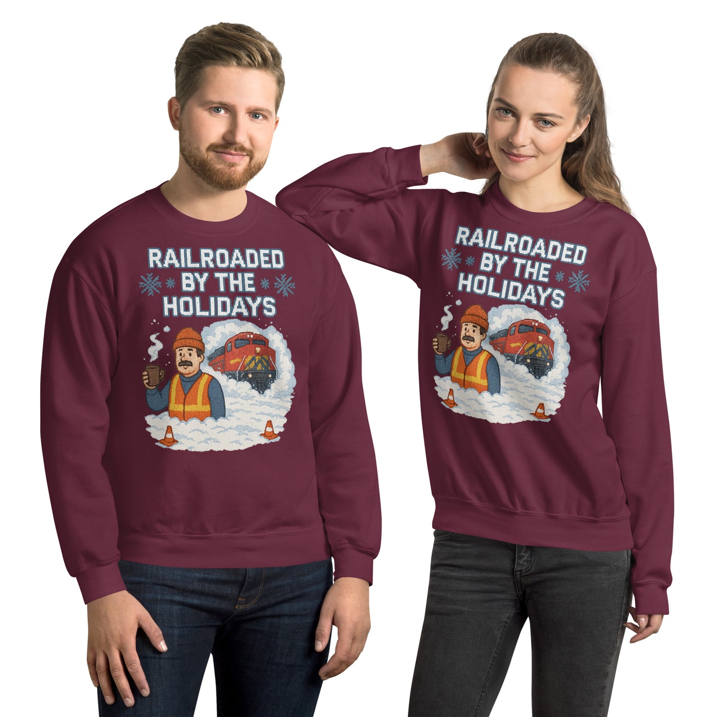 Two people wearing maroon sweatshirts with a Christmas-themed graphic and text.