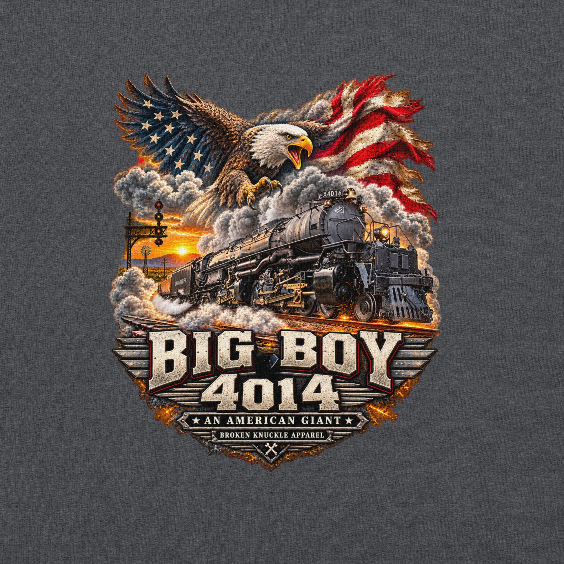 Gray heavy blend pullover hoodie featuring a highly detailed patriotic graphic. A bald eagle and American flag soar above the Big Boy 4014 steam locomotive charging down the tracks at sunset. Bold metallic-style text reads "BIG BOY 4014" above a banner reading "AN AMERICAN GIANT" and the Broken Knuckle Apparel logo.