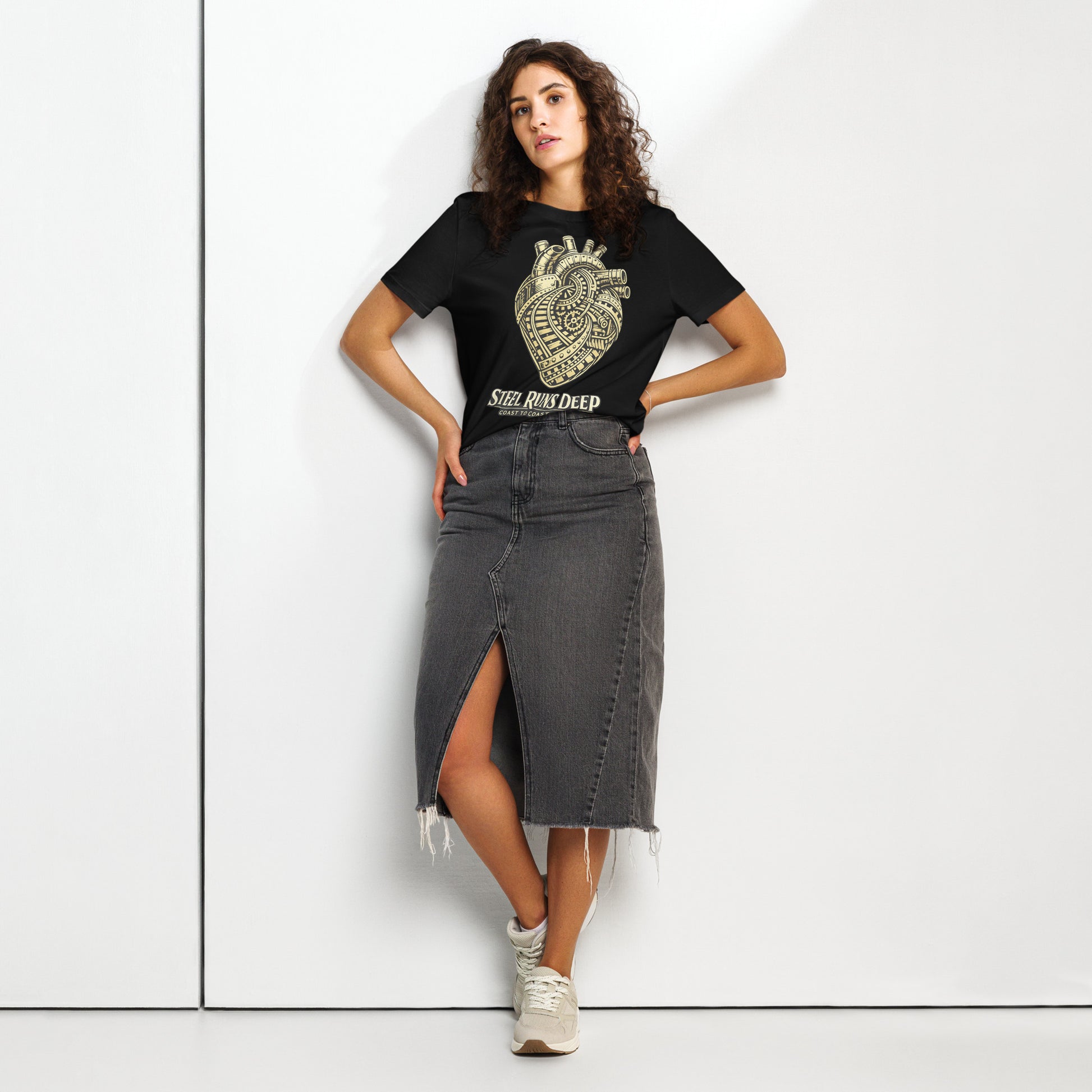 Black women's t-shirt featuring an intricate vintage illustration of a mechanical heart made of train tracks and gears, with text reading "Steel Runs Deep" and "Coast to Coast 2026".