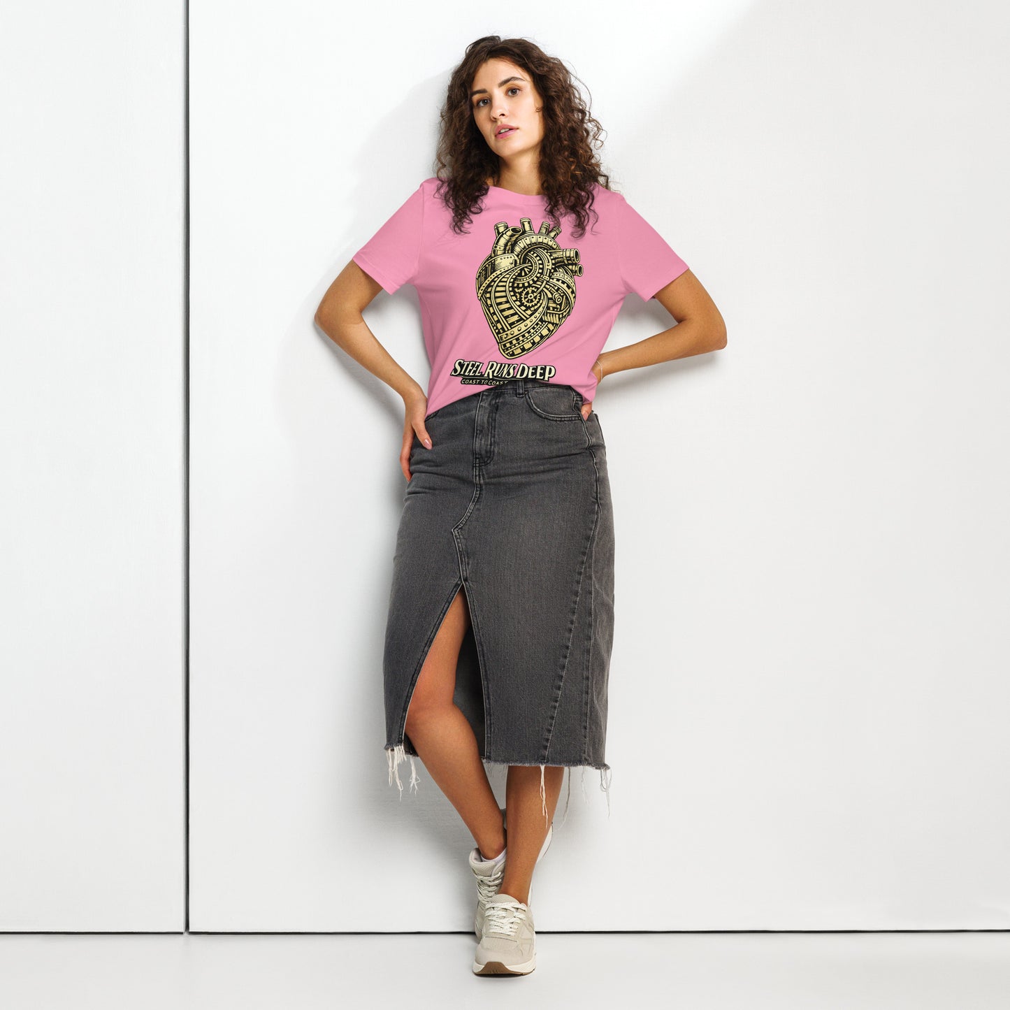 Pink women's t-shirt featuring an intricate vintage illustration of a mechanical heart made of train tracks and gears, with text reading "Steel Runs Deep" and "Coast to Coast 2026".