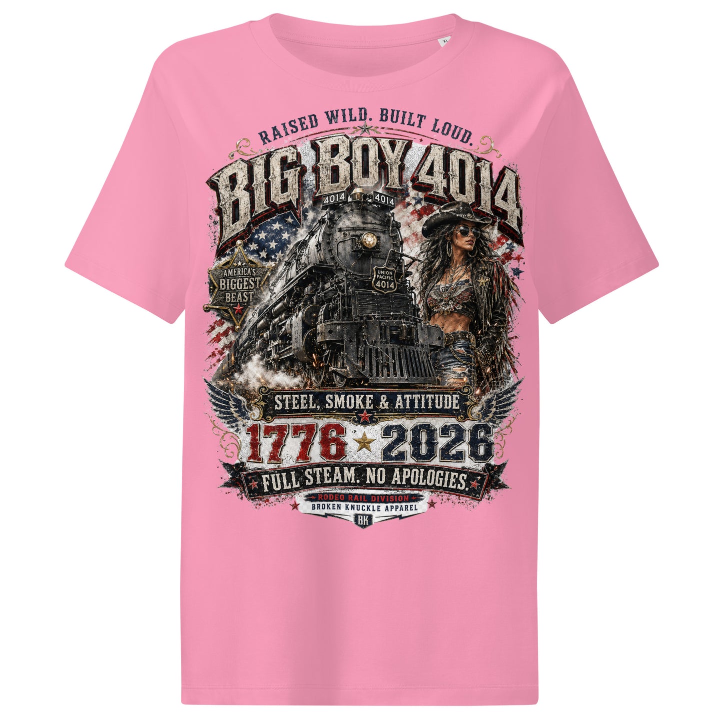 Pink women's ribbed neck t-shirt featuring a gritty graphic of the Big Boy 4014 steam locomotive next to a woman in a cowboy hat and leather jacket. The background includes a distressed American flag and eagle wings. Text reads "RAISED WILD. BUILT LOUD.", "BIG BOY 4014", "AMERICA'S BIGGEST BEAST", "STEEL, SMOKE & ATTITUDE", "1776 - 2026", "FULL STEAM. NO APOLOGIES.", and "RODEO RAIL DIVISION".