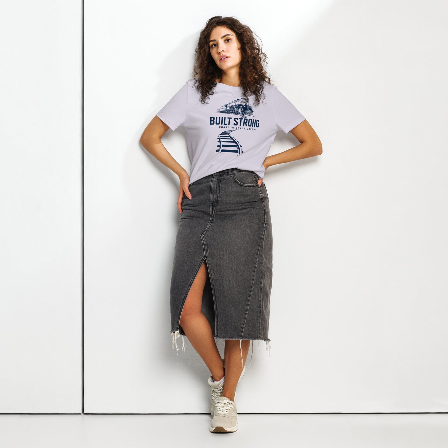 Lavender women's t-shirt featuring a sleek, dark line-art graphic of the Big Boy 4014 steam locomotive on curving tracks, with text reading "Built Strong" and "Coast to Coast 2026".