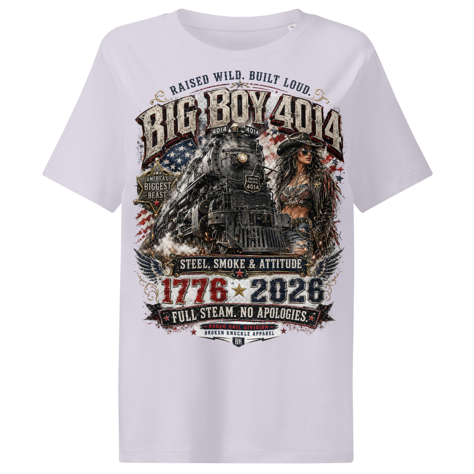 Lavender women's ribbed neck t-shirt featuring a gritty graphic of the Big Boy 4014 steam locomotive next to a woman in a cowboy hat and leather jacket. The background includes a distressed American flag and eagle wings. Text reads "RAISED WILD. BUILT LOUD.", "BIG BOY 4014", "AMERICA'S BIGGEST BEAST", "STEEL, SMOKE & ATTITUDE", "1776 - 2026", "FULL STEAM. NO APOLOGIES.", and "RODEO RAIL DIVISION".