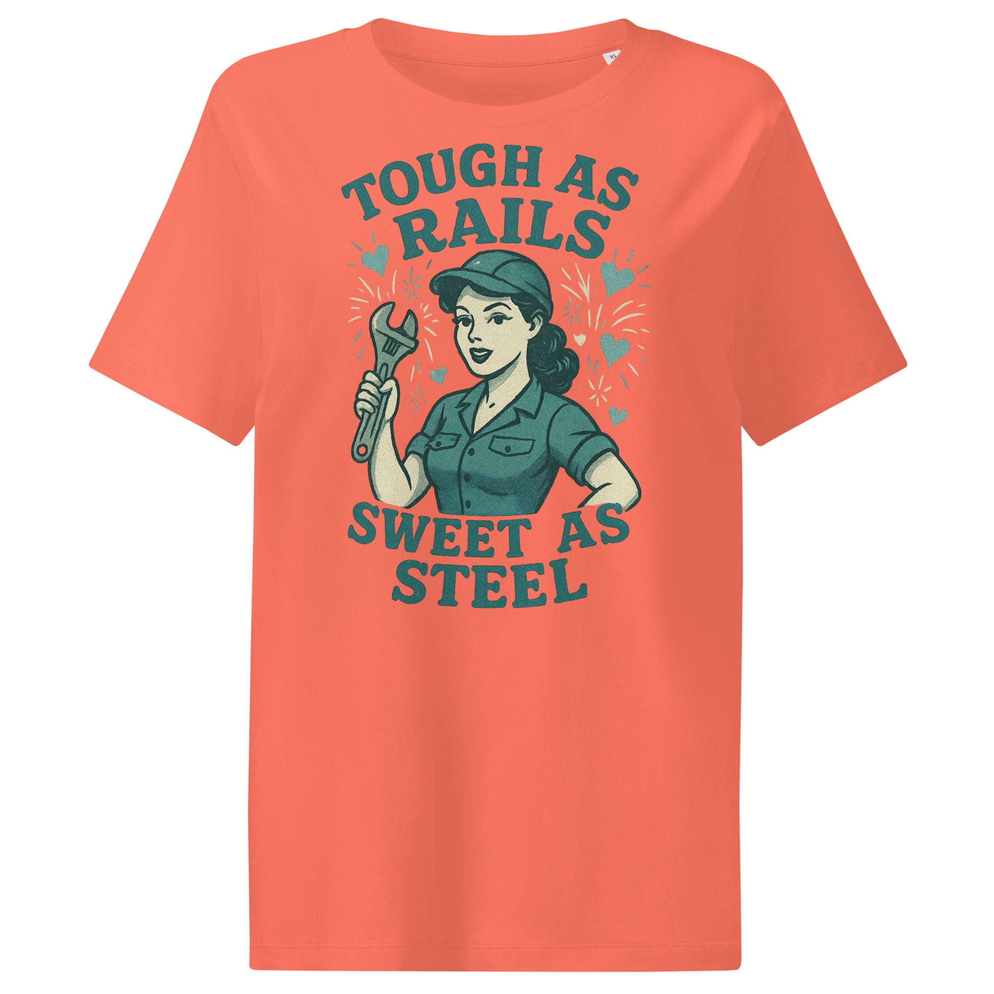 Orange t-shirt with graphic design of a woman holding a wrench and text 'Tough as Rails, Sweet as Steel' on a white background.