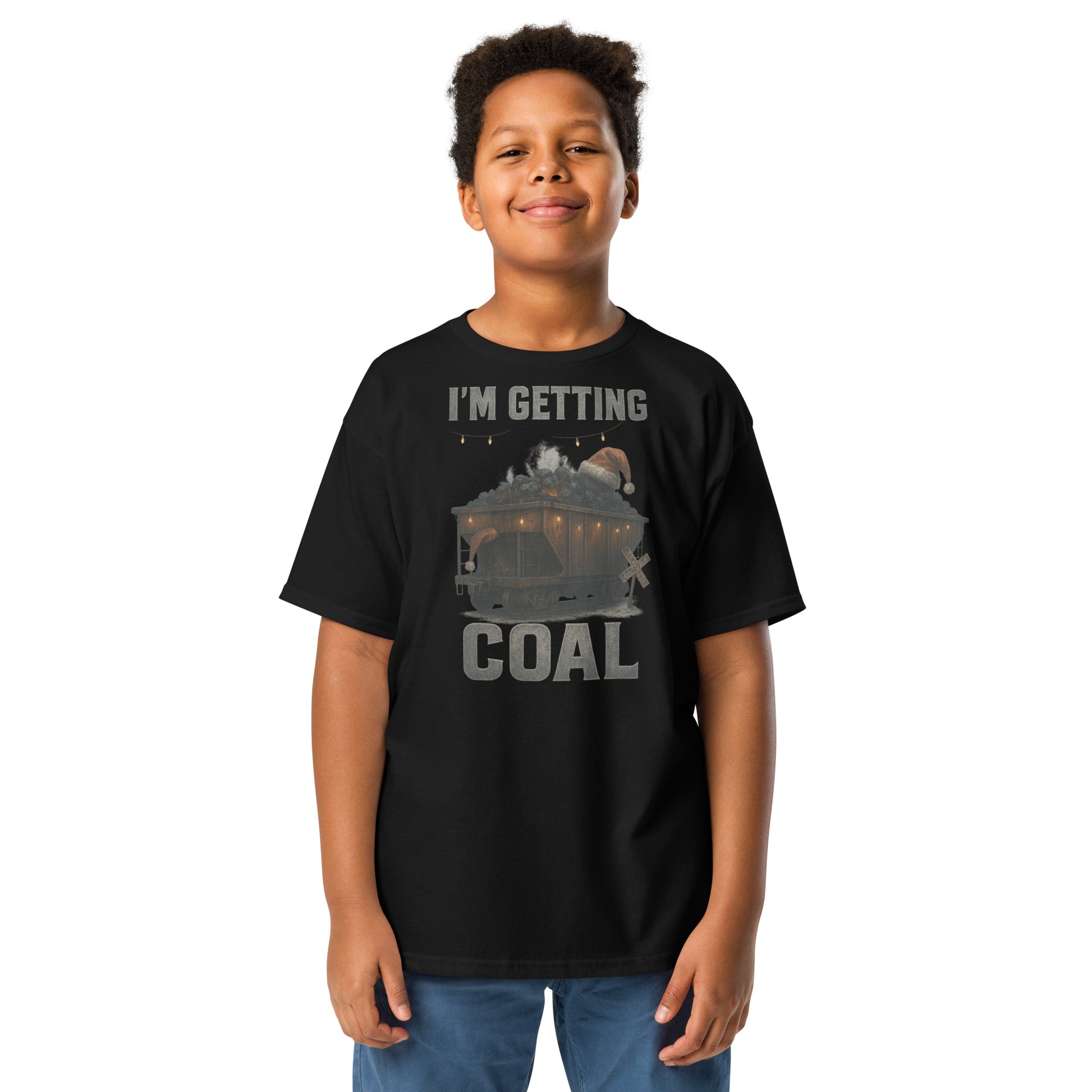 Child wearing a black t-shirt with 'I'm Getting Coal' graphic design on a white background