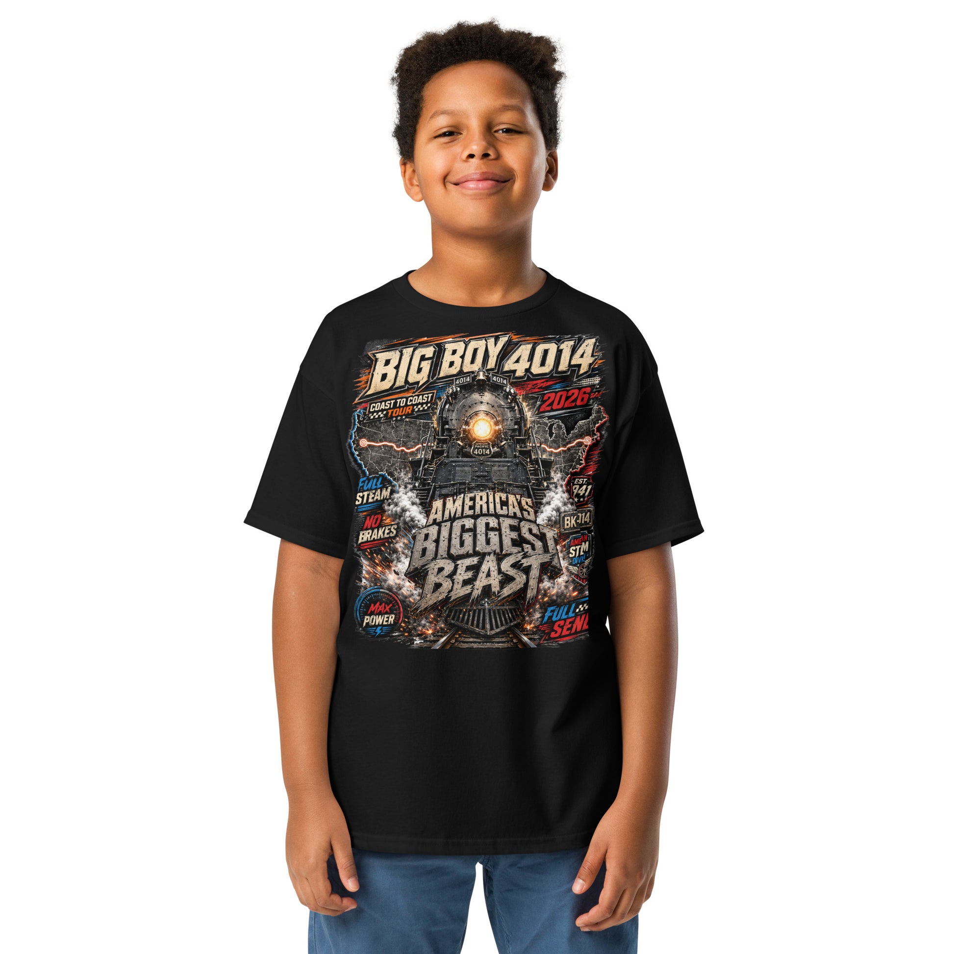 Child wearing a Youth black t-shirt featuring a high-energy, colorful graphic of the Big Boy 4014 steam locomotive backed by a US map, with bold text reading "BIG BOY 4014", "COAST TO COAST TOUR 2026", "AMERICA'S BIGGEST BEAST", "FULL STEAM", "NO BRAKES", "MAX POWER", and "FULL SEND".