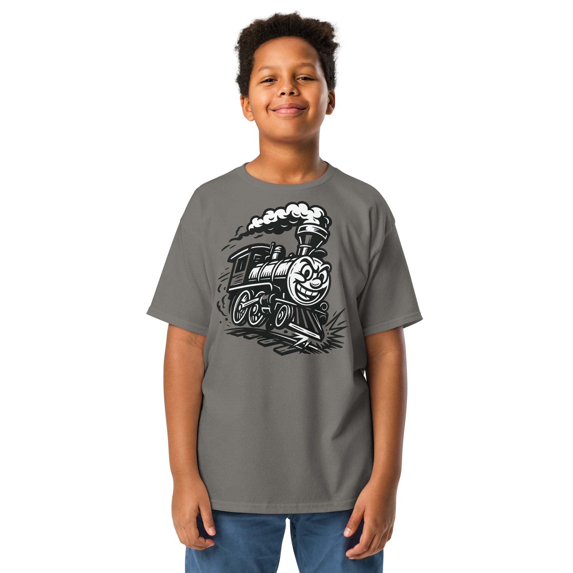Child wearing a gray t-shirt with a train graphic on a white background