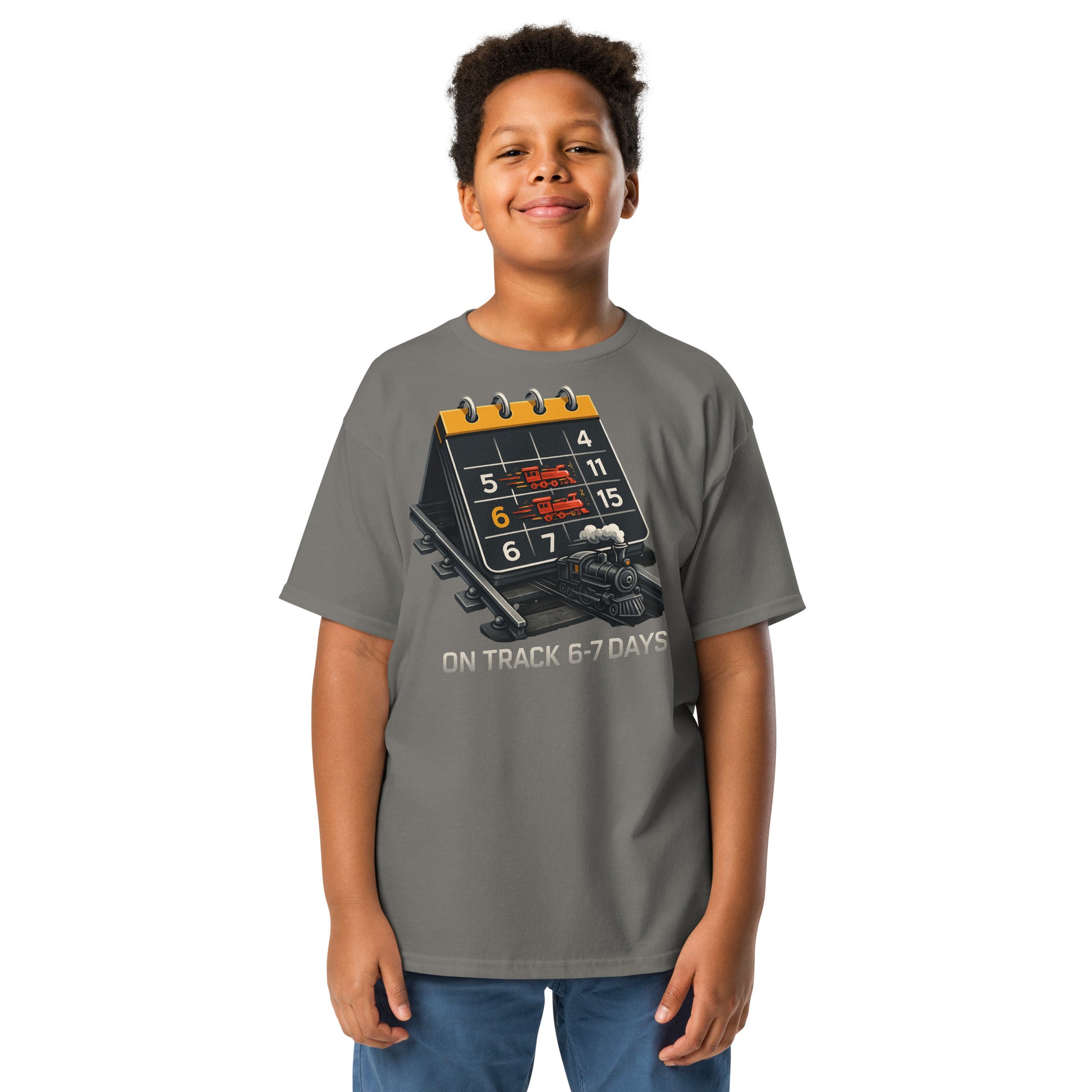 Child wearing a gray t-shirt with a graphic design on a white background