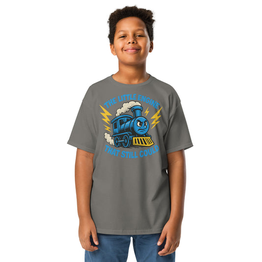 Child wearing a gray t-shirt with a blue train graphic and text on a white background