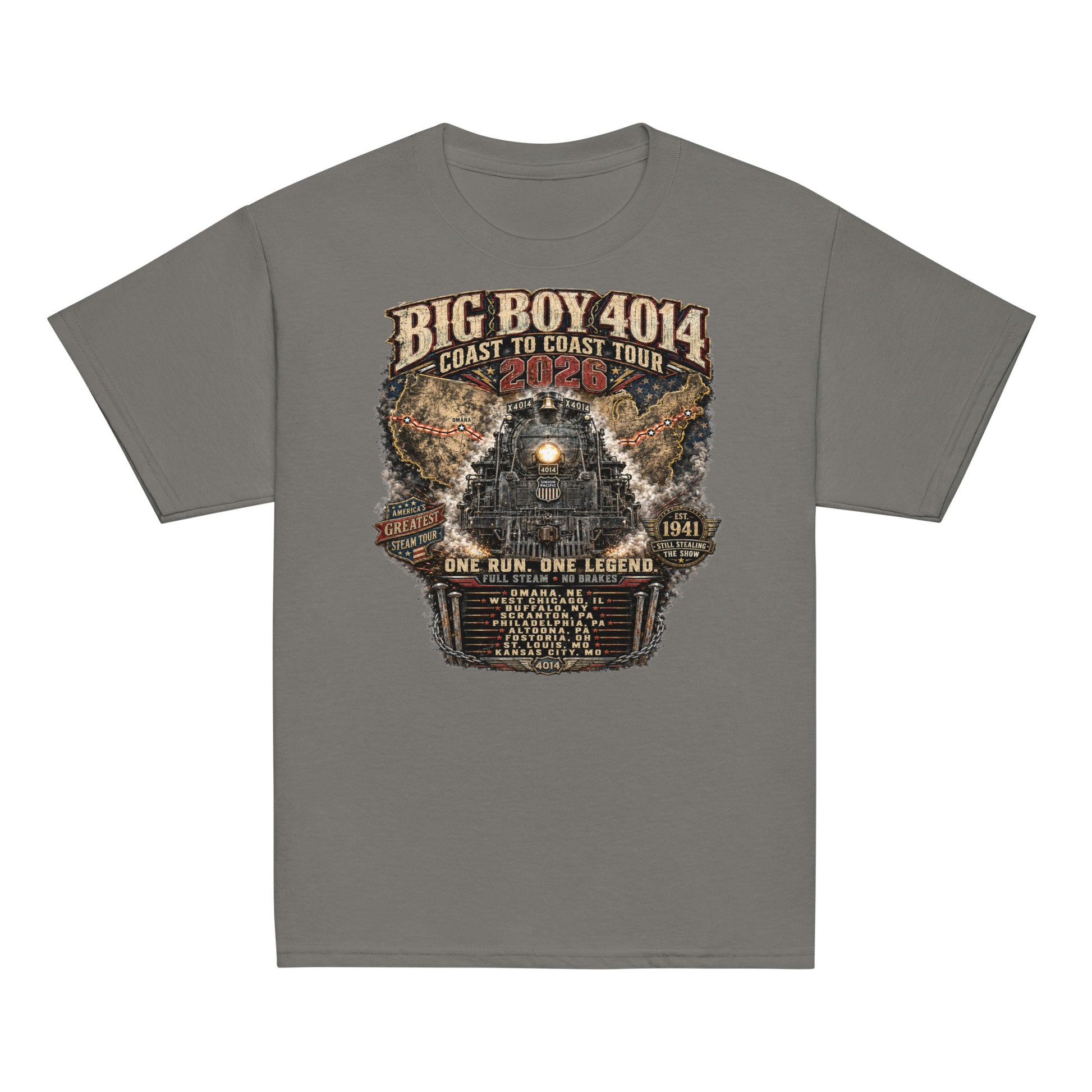 Youth gray t-shirt featuring a highly detailed vintage graphic of the Big Boy 4014 steam locomotive facing forward. Behind the train is a map of the United States showing the 2026 tour route. Text reads "BIG BOY 4014", "COAST TO COAST TOUR 2026", "ONE RUN. ONE LEGEND.", and "FULL STEAM - NO BRAKES". The graphic includes badges for "America's Greatest Steam Tour" and "Est 1941", along with a roster of the nine tour stops.
