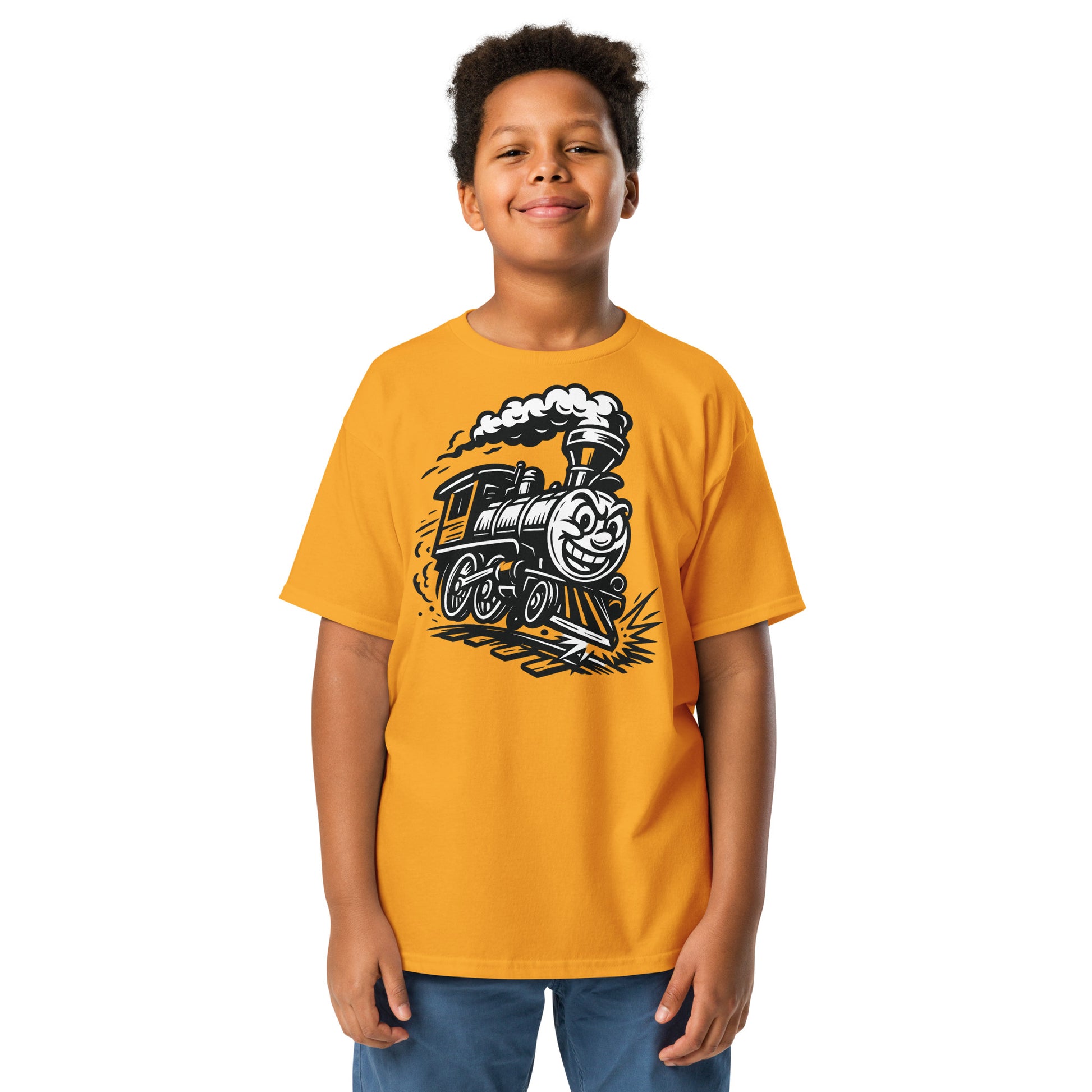 Child wearing a yellow t-shirt with a train graphic on a white background