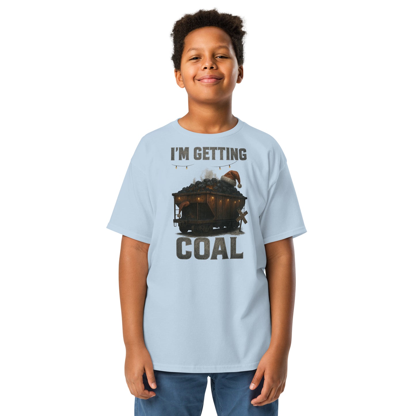 Child wearing a light blue t-shirt with a graphic and text 'I'm Getting Coal' on a white background