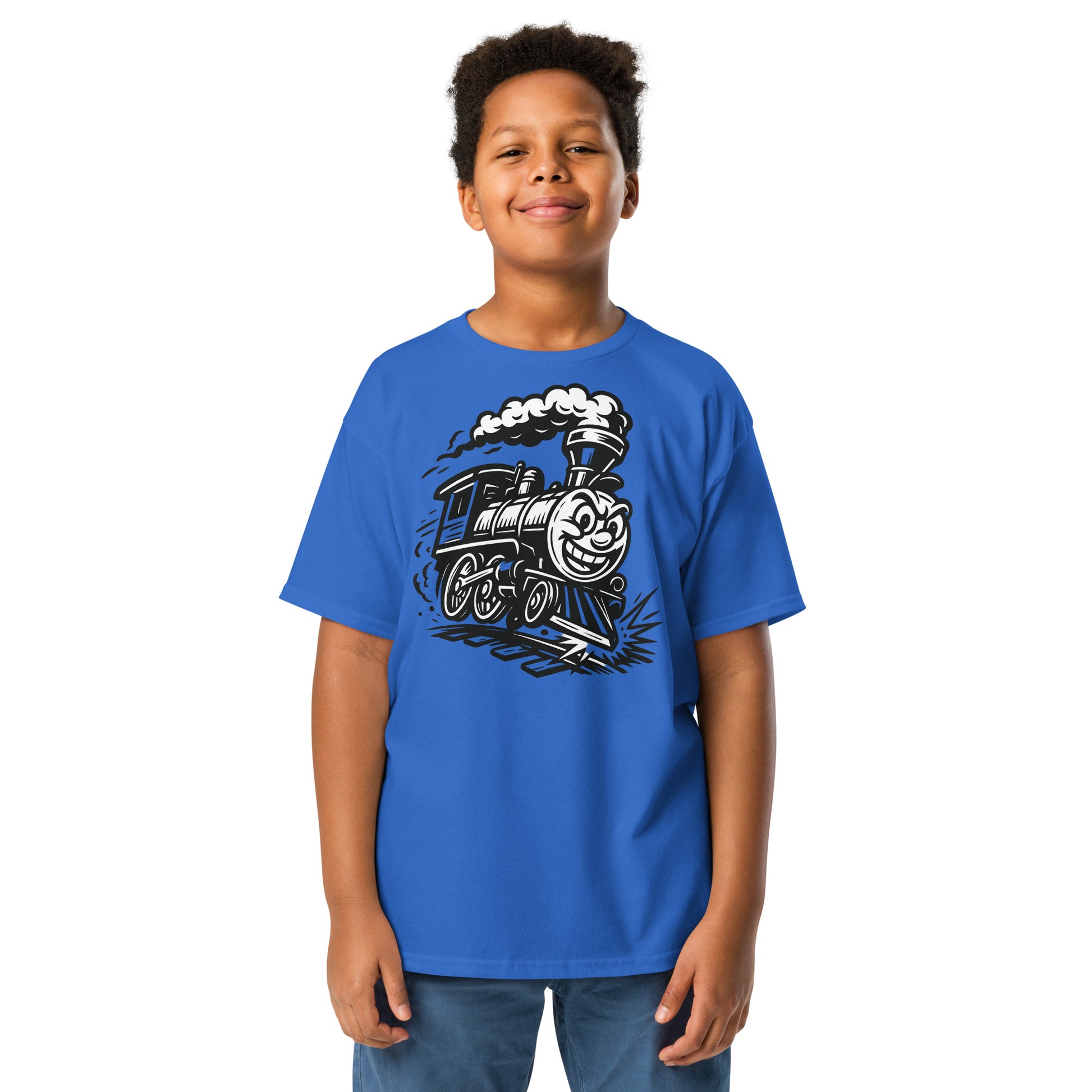 Child wearing a blue t-shirt with a train graphic on a white background