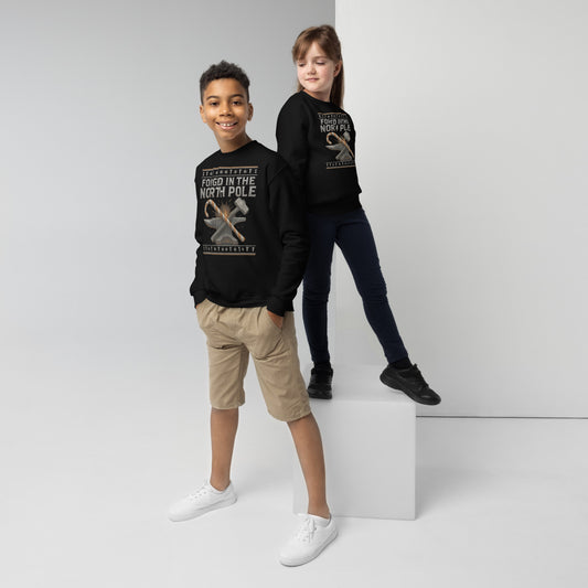 Two children wearing black sweatshirts with text and graphics on a white background